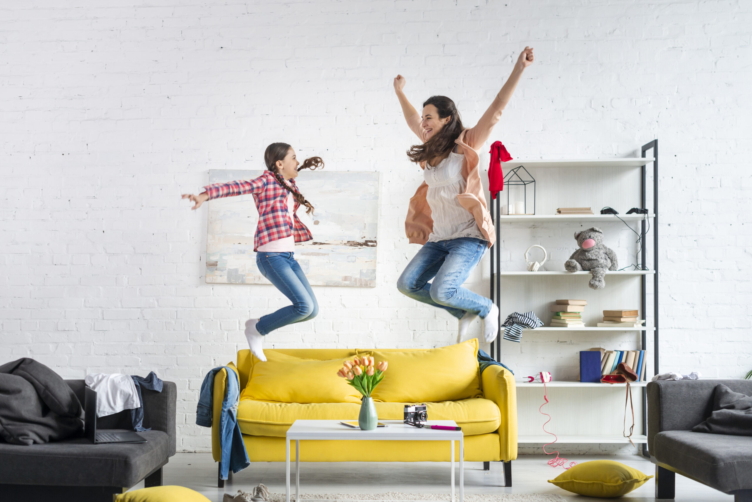 mother-daughter-jumping-couch